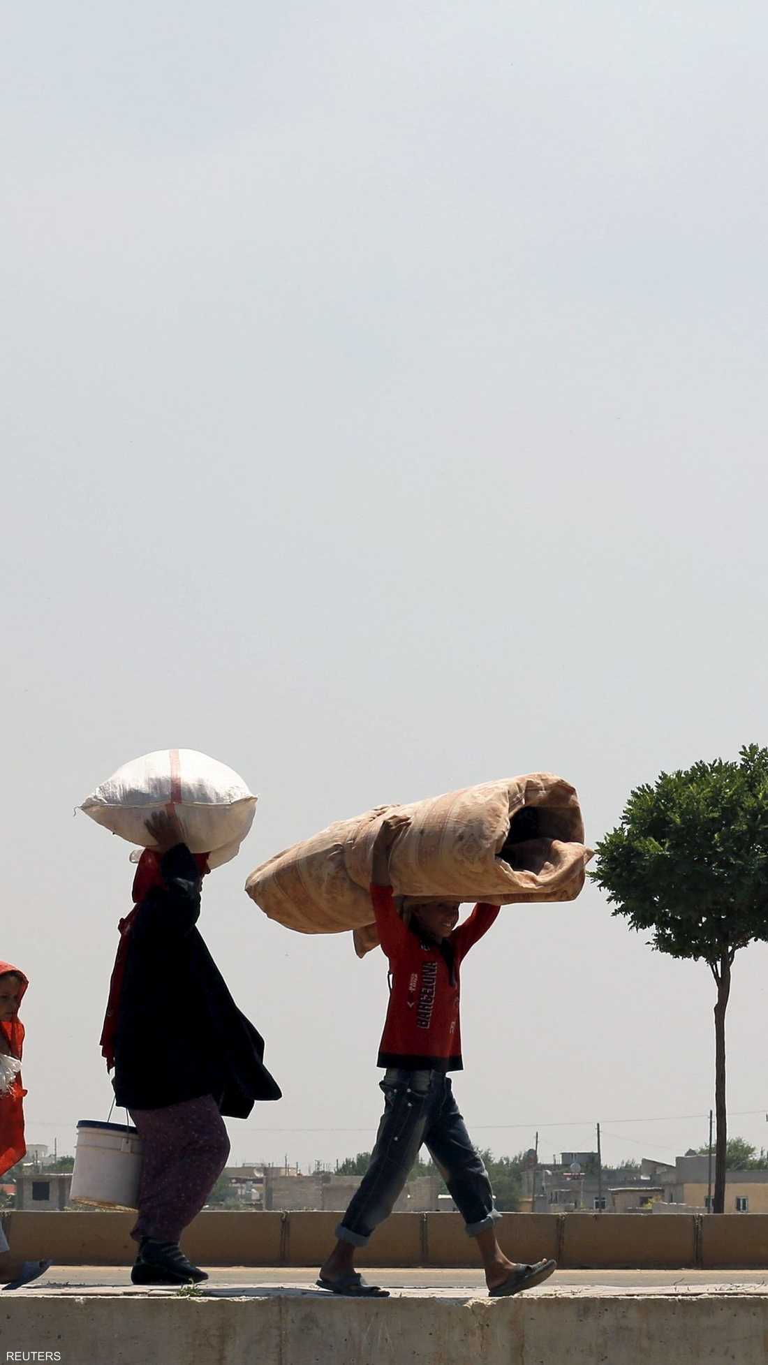 المعارك في تل أبيض أدت إلى نزوح نحو 23 ألف سوري إلى تركيا